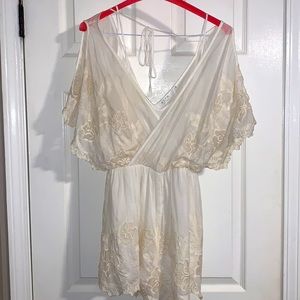 ASTR Egg shell white floral pattern short romper. Small